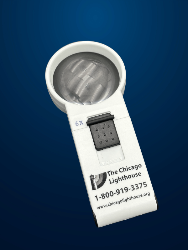 6X Round illuminated Hand-Held magnifier in white with black switch and Chicago lighthouse logo