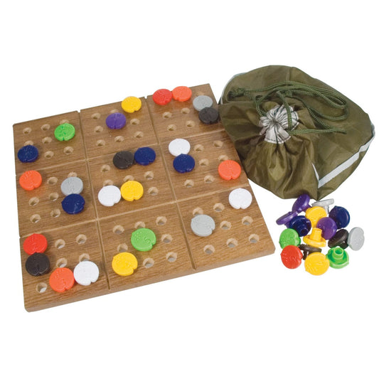 Braille Sudoku set with colored pieces, a small pull string pouch, and a wooden board.