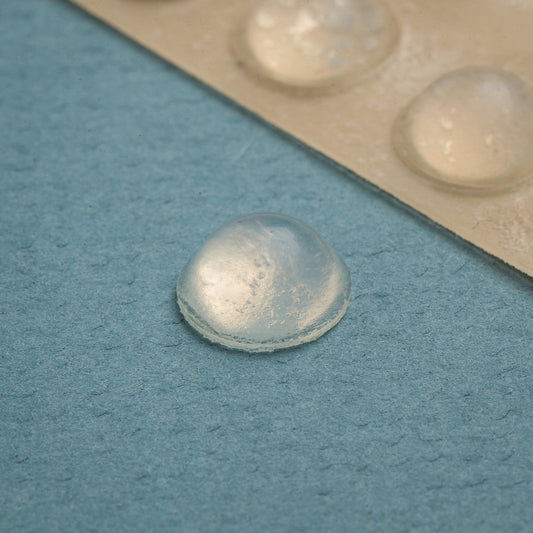 25 clear medium Can Do Bump dots. One silicone rubber bump with adhesive back that adheres to just about any smooth surface. Bumps measure 9.5 mm (.37") in diameter by 3.8 mm (.15") in height.