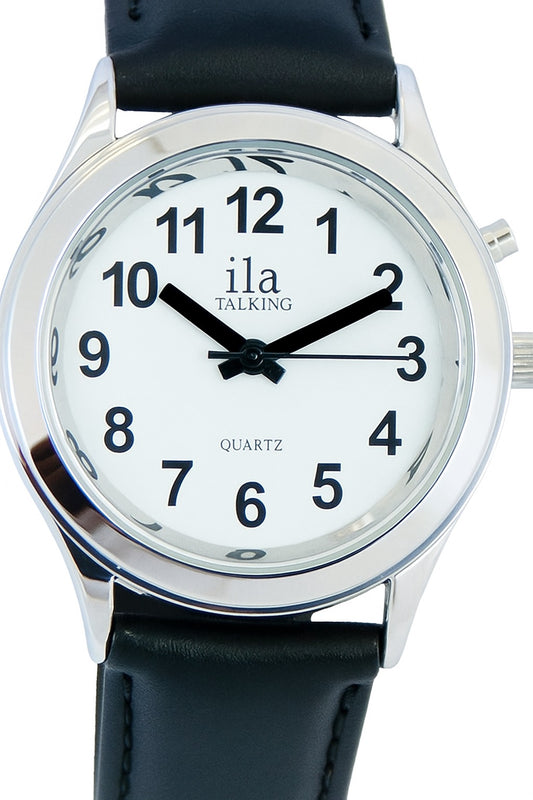 Close-up image of an ila Talking quartz wristwatch with a white face, bold black Arabic numerals, and black hour and minute hands pointing to 10:00 and 2:00. The watch features a silver-tone bezel and a smooth black leather strap. A side button is visible, used for the talking function.