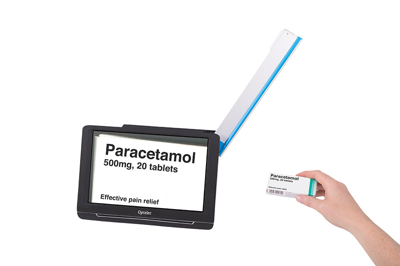 The Optelec Compact 10 HD portable digital magnifier designed for users who are low vision and visually impaired features it's extended arm scanning a prescription box and displaying it on the Compact 10 screen.