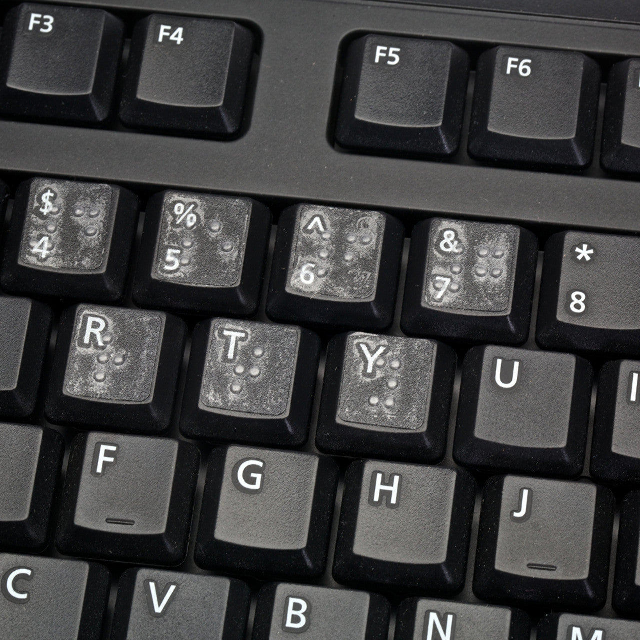 The Transparent Braille Keyboard Stickers are designed with transparent material and features Braille symbols corresponding to each key on the keyboard. 