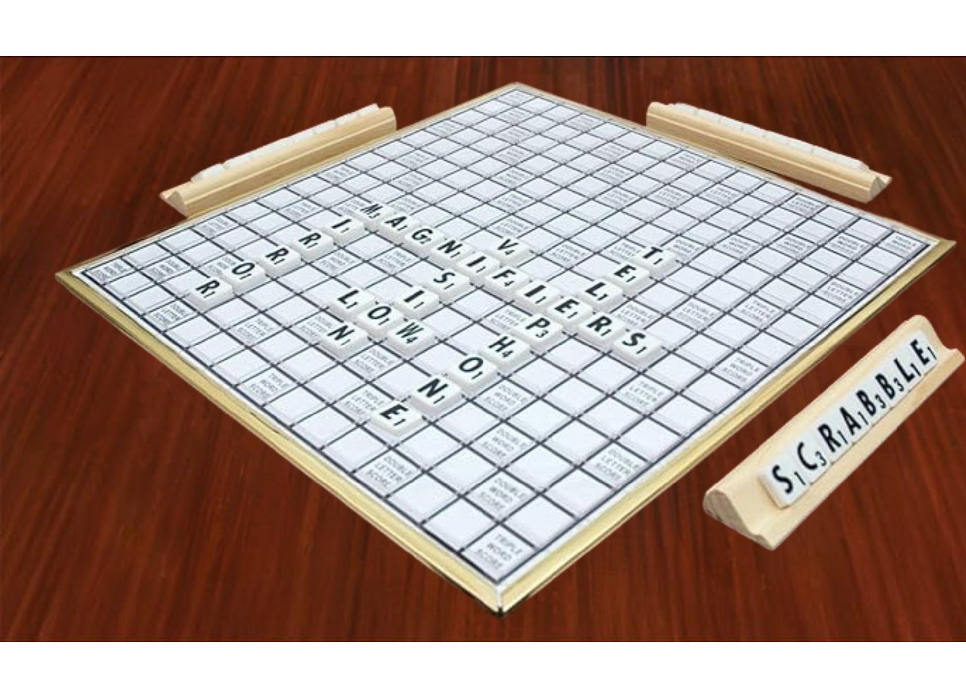 Deluxe Low Vision scrabble board with an ongoing game. Words on the board spell Mirror, Magnifiers, Low, Vision, Telephone. On a Letter holder o the side the letters spell scrabble