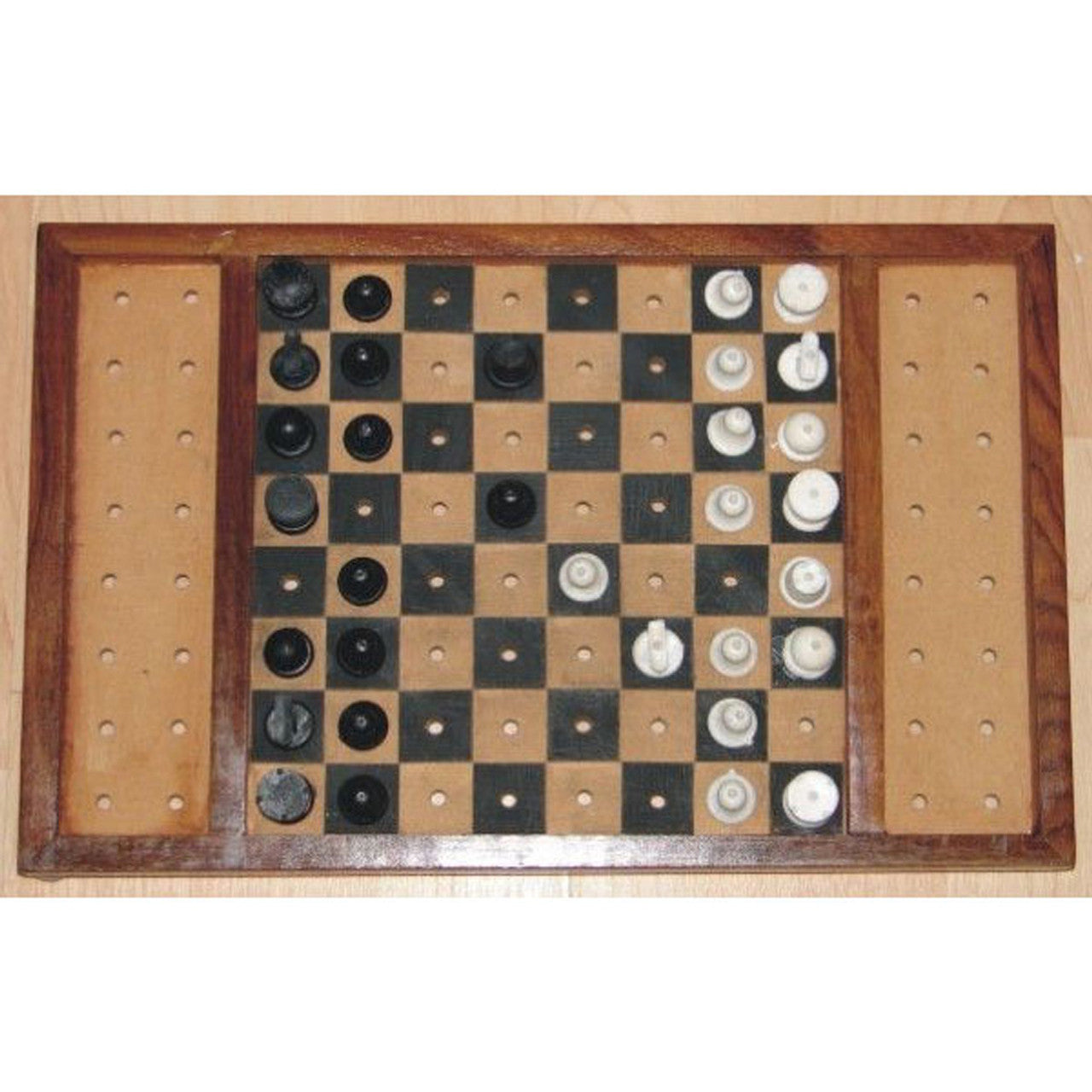 Chess set with black and white game pieces on a wooden chess board.