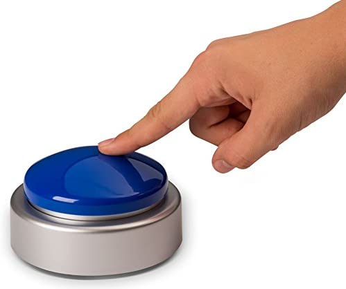 The Loud Boost Extra Large Talking Clock is shown with a hand pressing it's large blue button with an index finger.